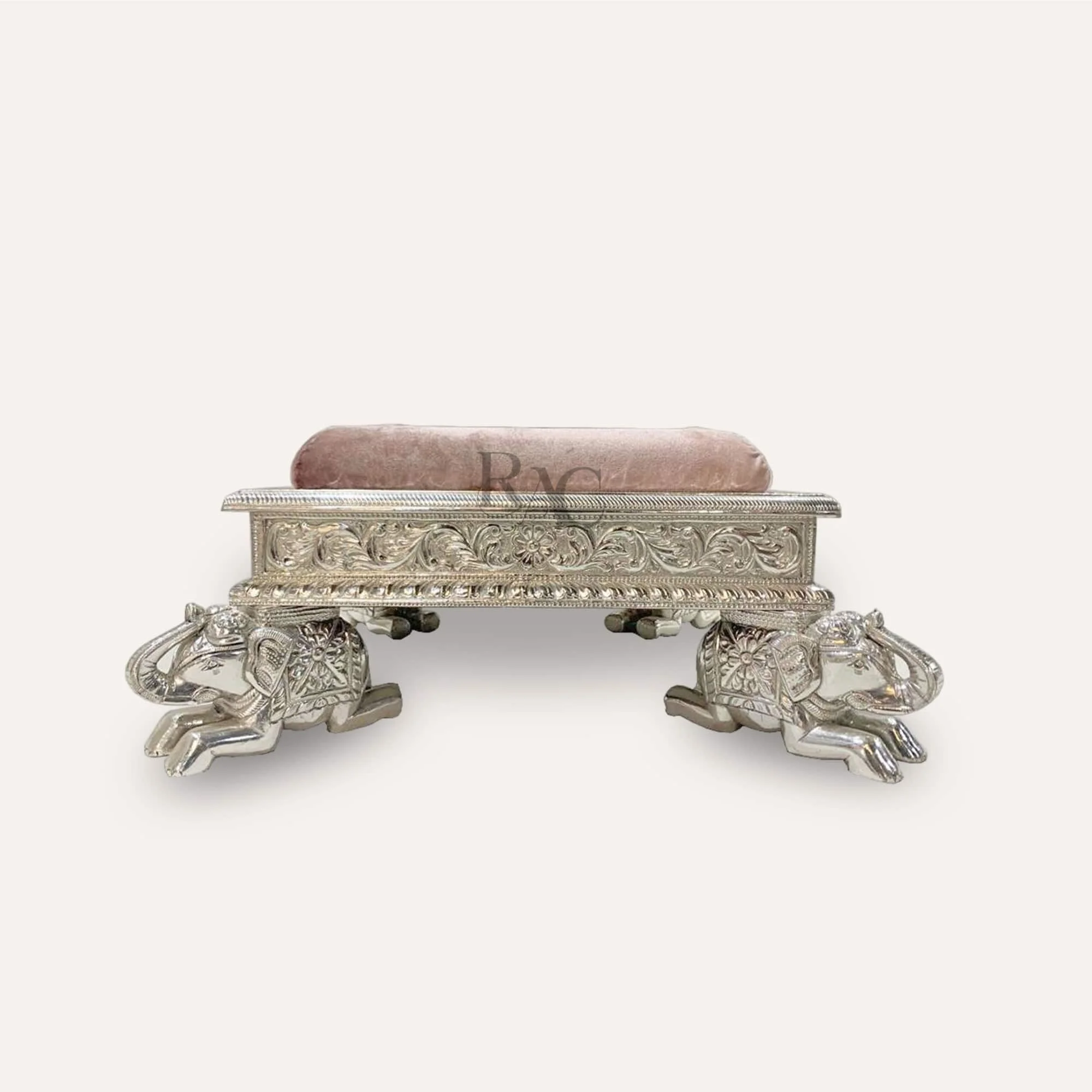 Silver furniture with intricate carving and polish